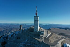 Drone shot of the iconic Mont Ventoux Observatory in Vaucluse, France, captured on a clear day.